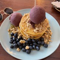 Vegan gluten-free pancakes with blueberries, maple syrup, açai ice and granola💚  at O Diplomata in Porto