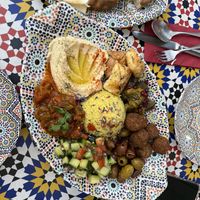 The big mezze plate for 2 (the puff pastries next to the hummus are NOT vegan, and were given to us by mistake)   at Barbès Bar in Luzern