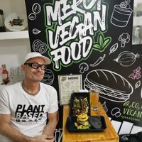 Me and the sign at Mercy Vegan Food in Bogota