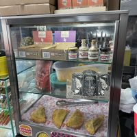 Glass case with goodies  at Mercy Vegan Food in Bogota