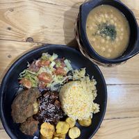 Menú del día: fried broccoli, creole potatoes, salad, BBQ tofu and chickpea soup. Came with agua de panela.   at Mercy Vegan Food in Bogota