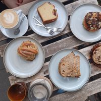 Cappuccino, orange cake, vanilla pudding bun, cardamom bun, pumpkin-tofu sandwiche, chocolate chip cookie, chai latte at Szklarnia in Krakow
