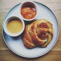 Cardamom bun with sea buckthorn jam and peanut butter :) at Szklarnia in Krakow