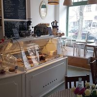 Interior of location - seating space and view towards the counter at Cafe Katulki in Berlin