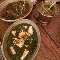 Smoky aubergine curry, yellow daal and spinach and tofu curry at Namaste Holborn in London