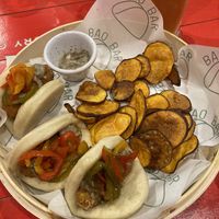 Vegan Baos (Sweet potato tater tot, pickled bell peppers, and a hint of Chilean chili) with rustic sweet potato chips  at Bao Bar in Santiago