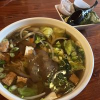 vegan pho with garnish on the sidee  at MOE PHO in Pendleton