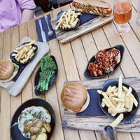 Vegan burgers & hotdog, cauli steak, cauli poppers, greens & a chip thief!  at The Fig in Malvern