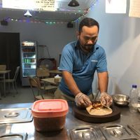 Hard at work  at Angkor Tacos - Food Stall in Siem Reap