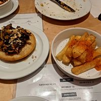 Rice pancake with pumpkin-peanut stew and cassava fries at Chuku's in North London