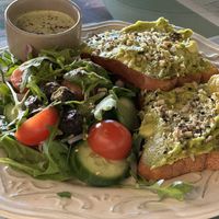 Avocado toast on gluten-free bread with salad  at Grandma's in Townsville