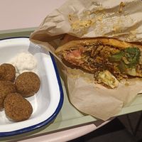 Vebab with bread and falafels as sides. at Gustavo in Grenoble
