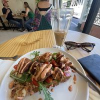 Tasty hash brown and cauli bites waffle with spicy sauce. Delicious iced coffee.  at Grumpy & Runt in Western Cape