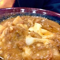 Peanut vegan over fufu with Sav’s hot sauce. at Sav's in Lexington