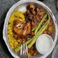 Jerk tofu with rice and asparagus-my go to ♥   at Ramsi's Cafe on the World in Louisville