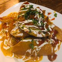 Chilaquiles - so many layers of vegan flavor!! Nachos on steroids (in a good way). at Ramsi's Cafe on the World in Louisville