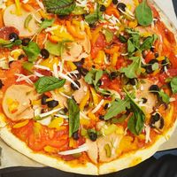 Фірмова піца без цибулі at Veganuti in Kyiv