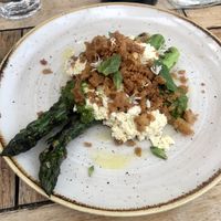 Asparagus with vegan ricotta and bread crumbs .  at Peachy Goat in South East London