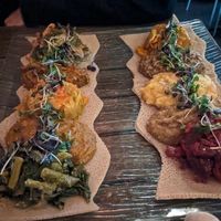 Both platters (mercato on the left and piassa on right) at Ras Plant Based in Brooklyn