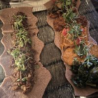 Kitfa injera and the platter  at Ras Plant Based in Brooklyn