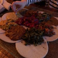 Food served Injera Bread at Ras Plant Based in Brooklyn