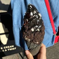 Bourbon soaked cherries, chocolate drizzle, Oreo crumbs, charcoal cone, and oat milk soft serve! at PERVERTED in Vancouver