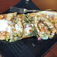 Cauliflower crust flat bread with pesto at Copper Branch in Vancouver