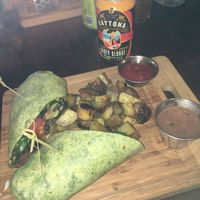 Bad lighting from the sun going down through the windows but vegan produce wrap was very flavorful! at Loading... Gastrobrunch in St Cloud