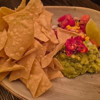 Guacamole $19.00: lovely crispy corn chips, not huge taste, the pico de gallo was bland, tomatoes used were floury at Vandal in Newtown