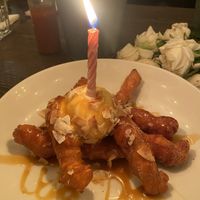 Churros with dulce de leche, cinnamon sugar, coconut gelato, toasted coconut flakes  at Vandal in Newtown