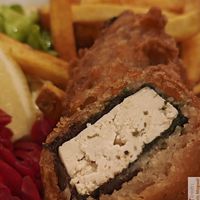  a marinated tofu fritter with home fries and lacto-fermented red cabbage with a homemade tartar sauce at Dis Leur in Bordeaux