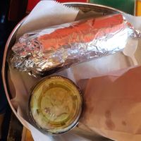 Vegan burrito, chips and guacamole  at Amelia's Taqueria in Boston
