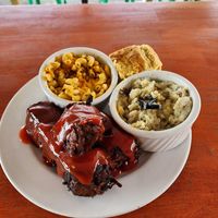 Ribs, mashed potatoes, mac & cheese, and cornbread at Sunshine Vegan Eats in Buffalo