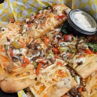 New Flatbread Pizza (comes in slices in to go box) at Sunshine Vegan Eats in Buffalo