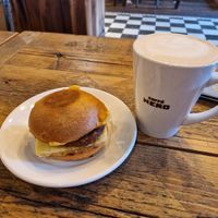 Vegan breakfast roll and an oat milk latte at Caffe Nero in Boston