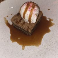 Cookie dough blondie with caramel sauce and vanilla ice cream  at Shrub in Chester