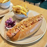 Hot-dog with a tasty grilled sausage, a serving of fries and some red cabbage slaw. Really nice!  at Shrub in Chester
