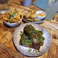 Top left to bottom: teriyaki tofu, frickles, potato terrine. at Shrub in Chester
