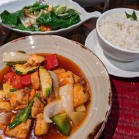 Sweet and sour tofu with mixed vegetables, Stir-fried green vegetables, and Coconut rice at Art of Siam Thai Cuisine in Newcastle-under-lyme
