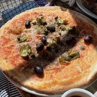 Vegan version of pizza fine on a gluten free base, with artichokes instead of anchovies at Franco Manca in Cambridge