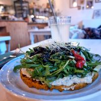 Sweet potato waffle with hummus and rucola etc on top at CLO in Antwerpen