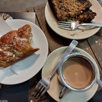 Danish nut, banana chocolate cake, and soy chai.. all vegan! at Café Moktan and Bakerys in Rishikesh
