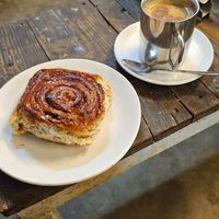 Coconut milk masala chai and cinnamon roll at Café Moktan and Bakerys in Rishikesh