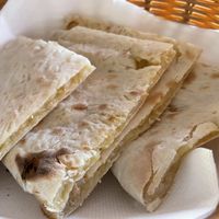 Naan stuffed with vegan cheese  at Saffron Mantra Indian in Carvoeiro