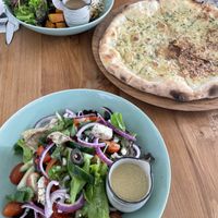 Vegan pizza and salad  at Nourish in Ungasan