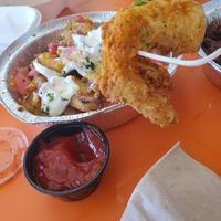 Jumbo prawns and fully loaded fries at The Rabbit Hole in Pompano Beach