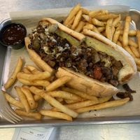 Vegan Philly cheesesteak sandwich with fries  at The Rabbit Hole in Pompano Beach