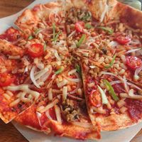 Pizza. It's a bit small to have it by itself but a good size for sharing between 2 people as a side. at Holy Holy Familiar Tree Cafe in Ikeda