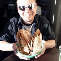 Colossal Grilled Reuben 
= 
Marinated tempeh, Daiya cheese, sauerkraut, and pickles with housemade Thousand Island Dressing...
+
grilled onions, jalapenos, avocado and housemade Chipotle Dressing. Served on rye bread.

Colossal it is, indeed! ~ at Nature's Express in Berkeley