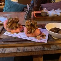 Vegan Bao Burger with wedges. Amazing! The photo doesn’t do it justice. The buns are pink   at Sista the Dumpling Shack in Kuta